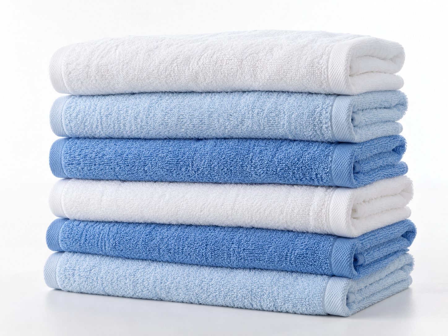 Stack of clean folded white and blue towels